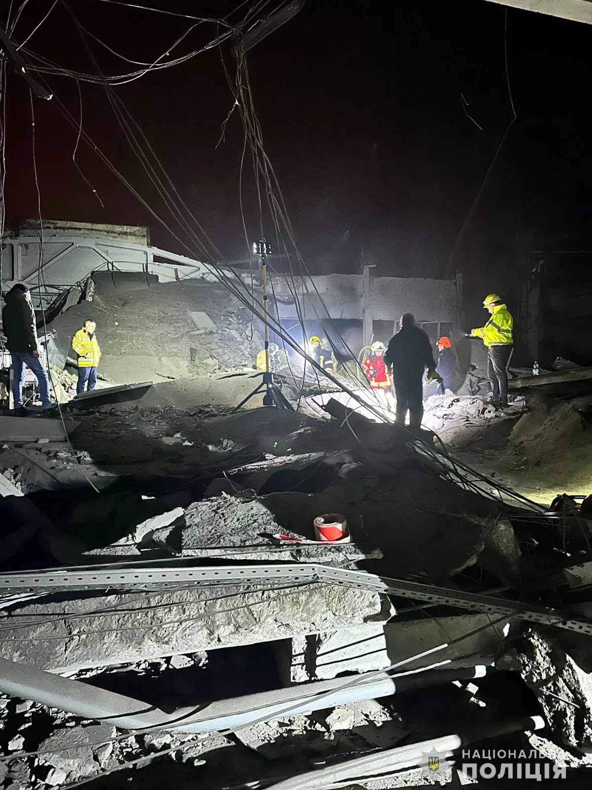 Rescuers dismantle the rubble at the site of a missile attack on a business in Mykolaiv on January 28 / Photo: National Police