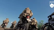 Moments of preparation of an assault motorcycle company / Frame from video