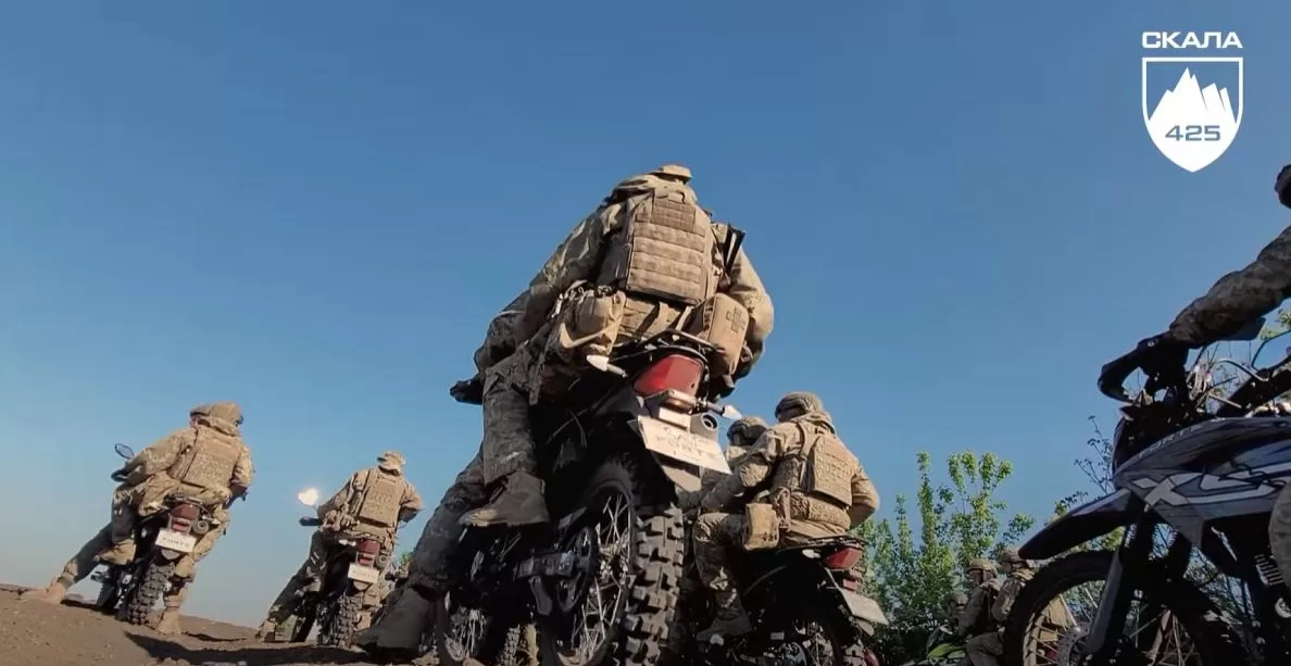 Moments of preparation of an assault motorcycle company / Frame from video