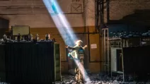 A ray of light falls on the silhouette of a soldier. Photo taken at the Azovstal factory / Author - photographer Dmytro Kozatsky, then a member of the Azov regiment