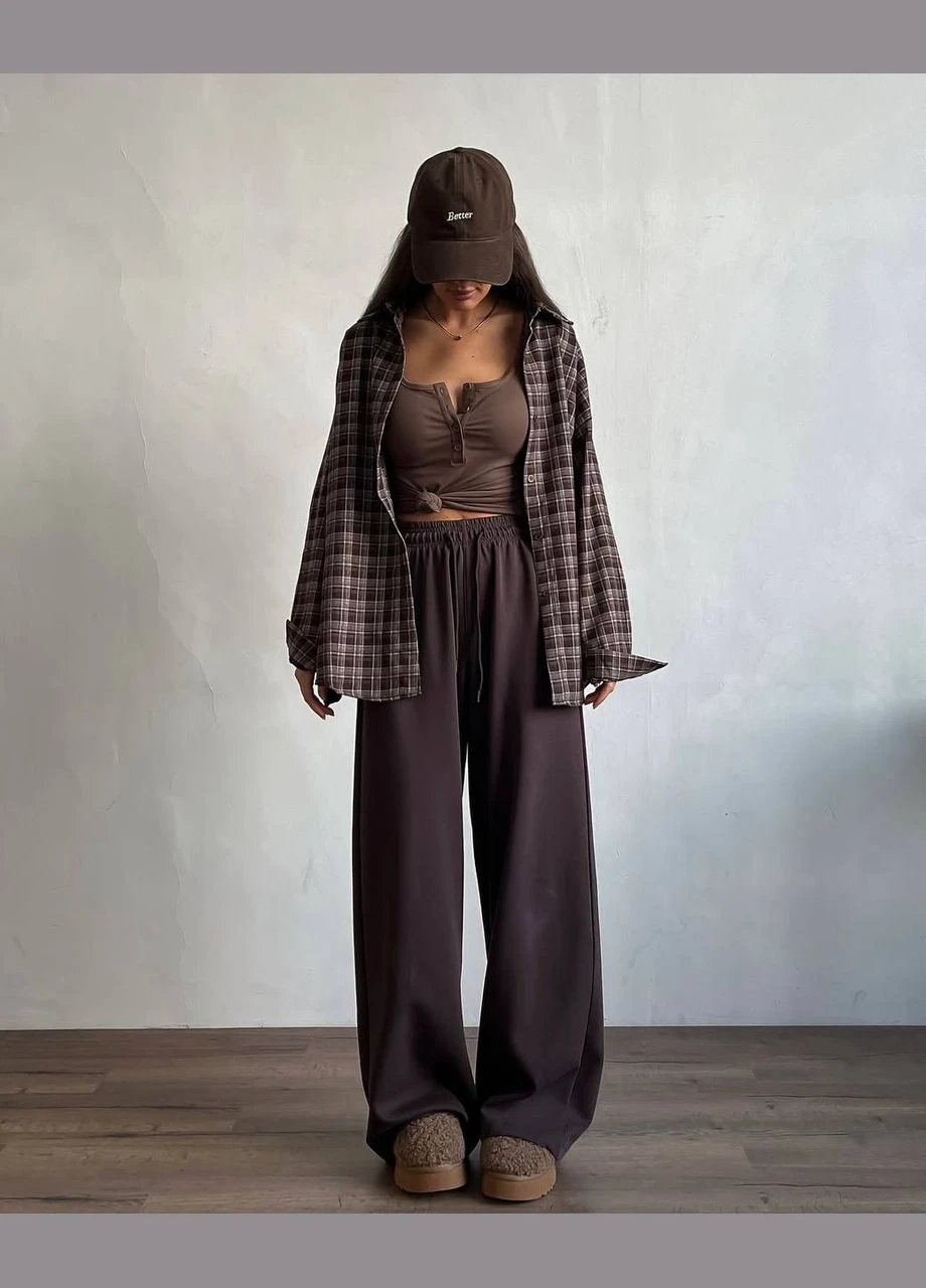 Стильна сорочка у клітку – must-have для базового гардероба. Вільний крій, м'яка бавовняна тканина та timeless картатий принт для універсальних образів.