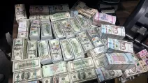 Изъятые во время обыска деньги / Фото: Нацполиция